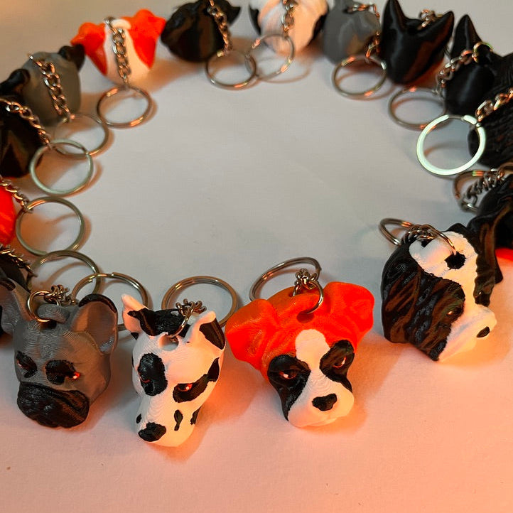 Bracelet with cow-shaped keychains on a light background