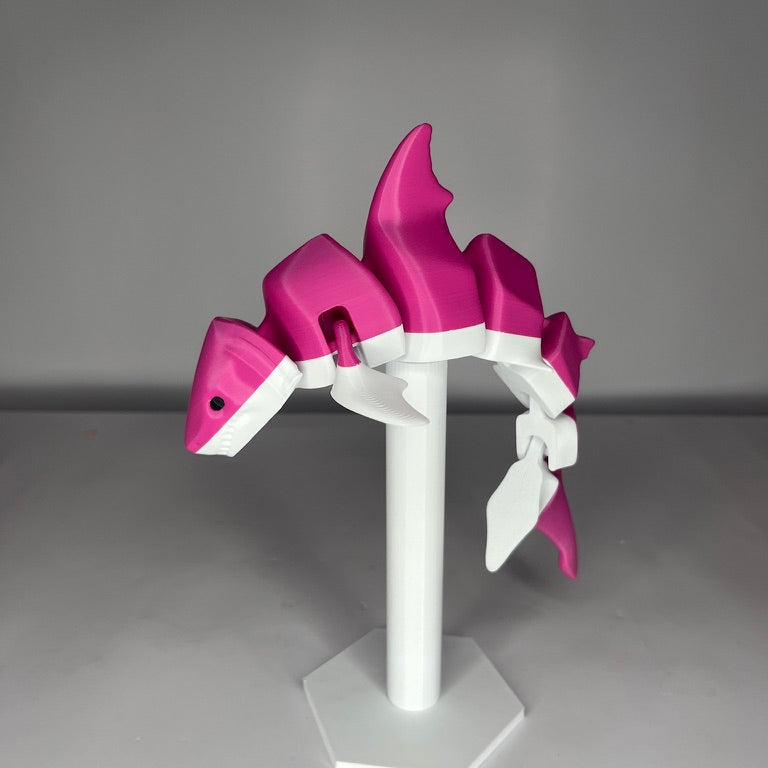 Pink and white helmet on a gray background